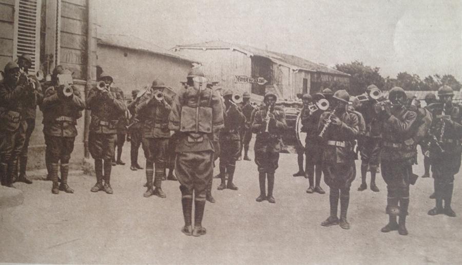 An American military band playing in July 1918. These are black American troops who served in US army units assigned to French divisions (note their French equipment).