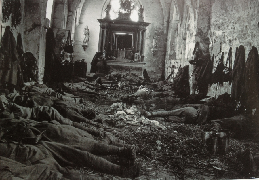 Soldiers sleeping in the ruined Saint-Martin church at Branges (Aisne). Photo taken by Frantz Adam, August 1918.