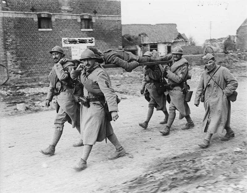 French stretcher-bearers transporting a wounded British soldier, March 1918.