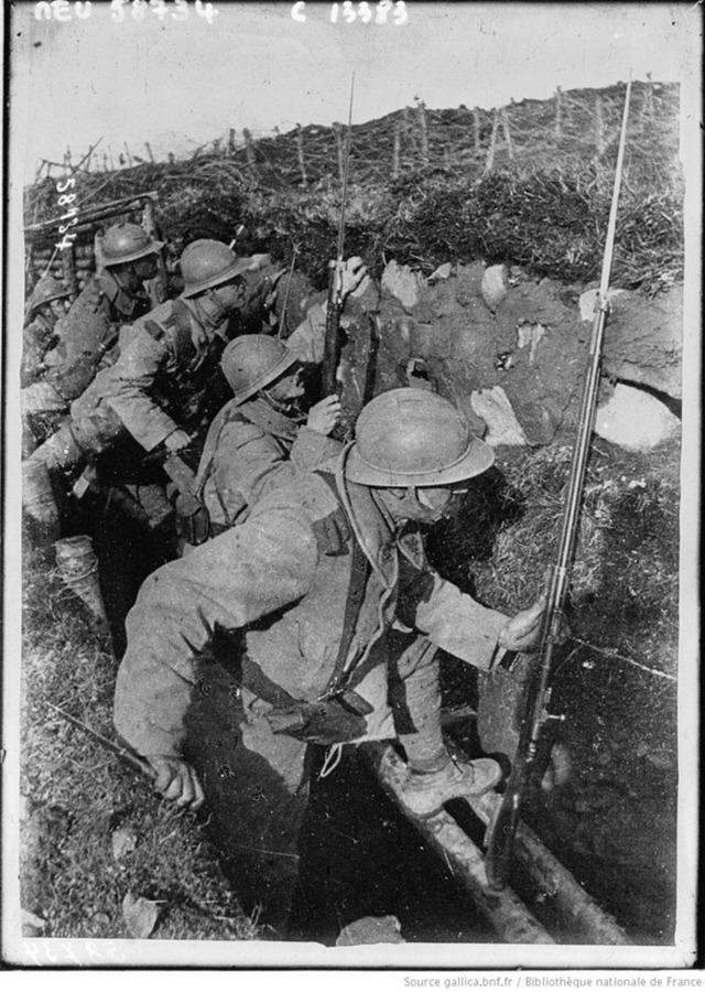 A posed photo of troops mounting the makeshift fire-step.