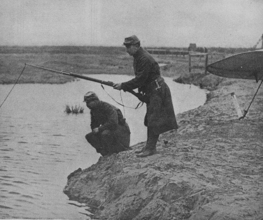 French soldiers with an improvised fishing rod. 