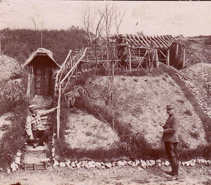 Shelters built into an embankment.