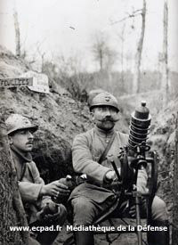 A soldier prepares to fire a trench mortar or 