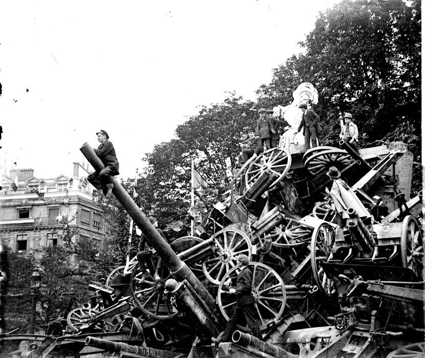 A post-war shot of the victory celebration on 14 July 1919 showing piles of confiscated German guns.