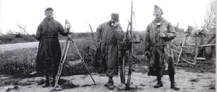 A group of artillery observers wearing camouflage frocks.