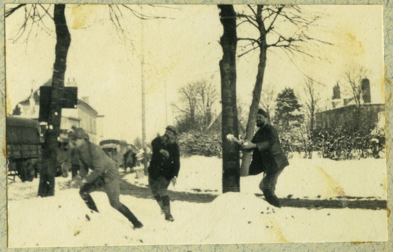 Soldiers take a moment to engage in frivolous snowball fight.