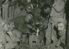 Troops resting in a bunker. 