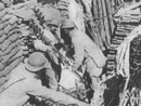 A supply dump in a support trench--sections of wattling, sandbags, iron barded-wire stakes.