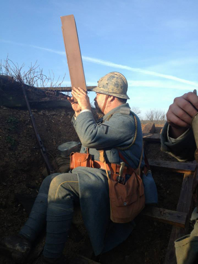 Sdt. Maillard observes the German lines through a periscope, April 2014.