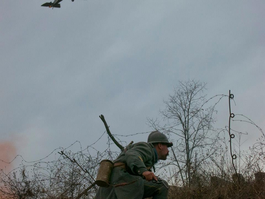 Sgt. Contamine takes cover during an assault on the German lines as an Allied fighter plane swoops down (just out of frame), November 2014