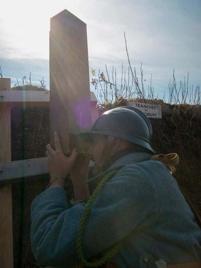 Sdt. Dujardin peers through a periscope at the German lines, November 2014