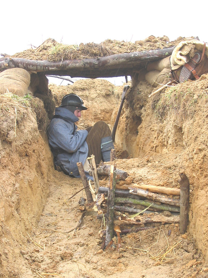 Sdt. Studer, small shelter of logs with sod roof - Newport News, VA, March 2005