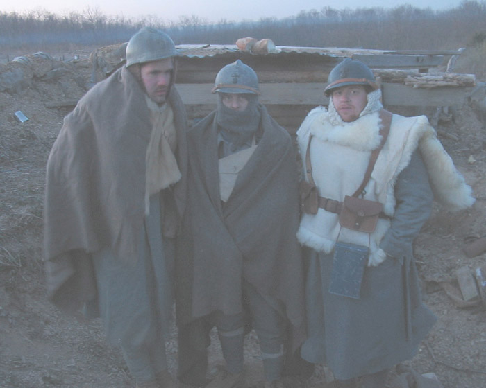 Dawn--three cold, weary soldiers after having caught only a few hours rest in the trenches, April 2005.