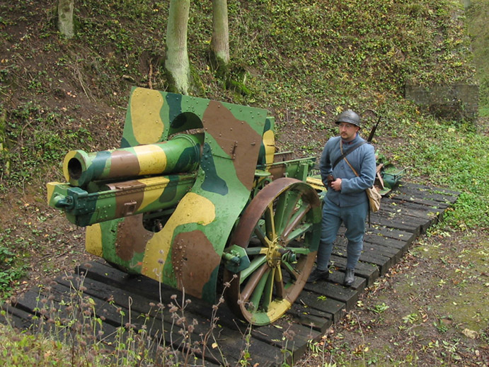 Arnaud Convard, of the Poilu of the Marne Association, stands beside a French 155mm canon, Fort  Seclin, France, October 2004.