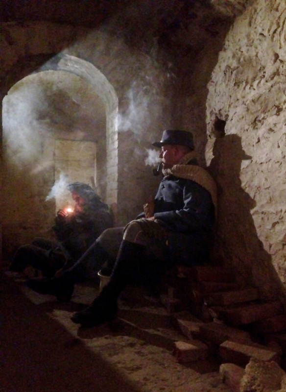 Smoking pipes in the subterranean vaults of Fort Mifflin. This particular room was an old prison cell. Fort Mifflin, March 2013.
