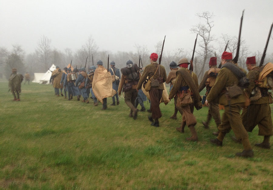 The French company marches through a sudden downpour. Newville, April 2013.