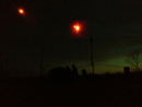 Flares descend in the night sky as soldiers man their post, April 2014.