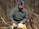 Cpl. Picard beside a distribution of shoe polish and boots, April 2014.