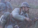 Sgt. Contamine takes cover during an attack in no-man's-land, April 2004.