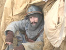 Sgt. Contamine in a small shelter dug into trench wall - Newport News, VA, March 2005