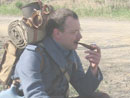 Sdt. Brun smokes a pipe after morning formation, April 2005.