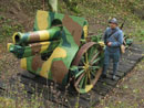 Arnaud Convard, of the Poilu of the Marne Association, stands beside a French 155mm canon, Fort  Seclin, France, October 2004.