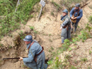 Training instructors clearing a trench with grenades, April 2012.