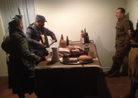 Sdt. Pernot explains the finer points of dinner etiquette to two Tommies. Fort Mifflin, March 2013.
