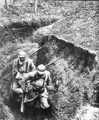 Two men carry out a wounded comrade.